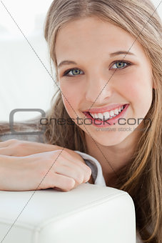 Close up of a smiling girl as she looks at the camera