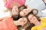 Four girls sleeping on the floor together