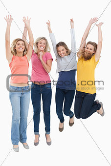 Smiling celebrating girls jumping up