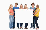 A group of people holding blank sheet