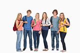 Smiling group with backpacks on as they smile