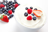 Bowl of cream with berries