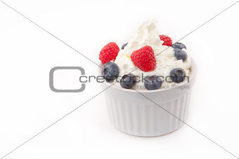 Jar of berries and whipped cream