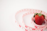 Strawberry surrounded by a ruler