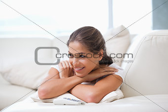 Women lying on a sofa while looking away