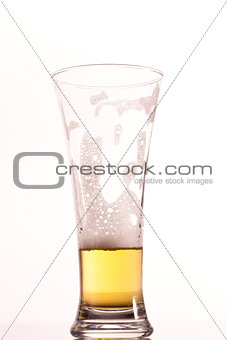 Almost empty glass of beer