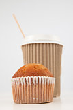 Muffin and cup of tea placed together