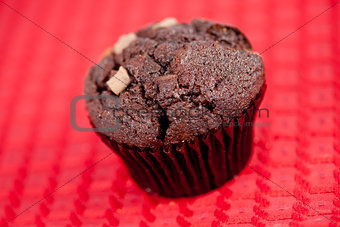 Chocolate muffin on a tablecloth