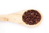 Wooden spoon with coffee seeds