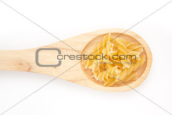 Wooden spoon with pasta