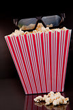 3D glasses on a box of pop corn