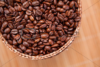 Roasted coffee seeds in a basket
