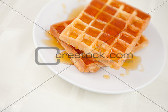 Waffles spread with honey