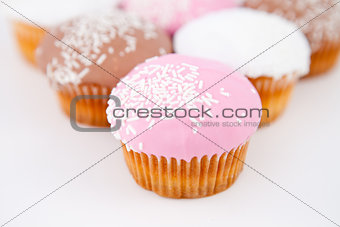 Close up on a pyramid of muffins with icing sugar