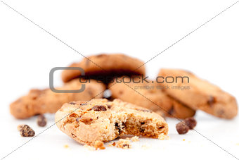 Half-eaten cookie in front of a stack of cookies 