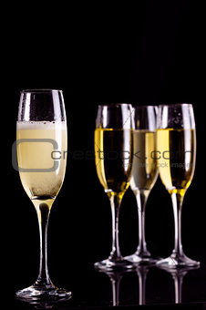 Four full flutes of champagne