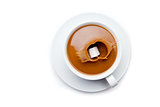 Sugar falling in a coffee cup