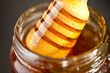 Honey dipper outgoing a jar
