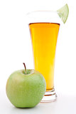 Apple near a glass of apple juice