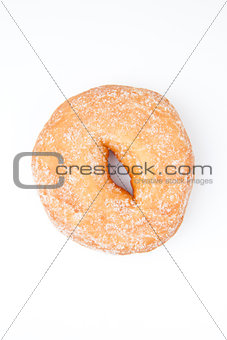 Extreme close up of a doughnut with icing sugar