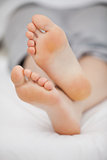 Close-up of the feet of a woman who is lying