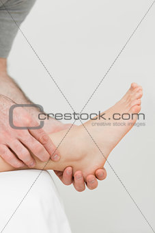 Ball of a foot being held by a practitioner