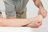 Physiotherapist stretching the ankle of a patient
