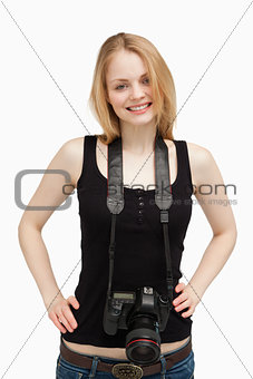 Joyful woman carrying a camera