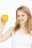 Smiling woman presenting an orange