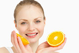 Close up of a joyful holding oranges