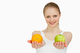 Young smiling woman presenting fruits