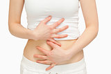 Woman touching her belly with her hands