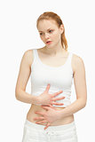 Serious woman placing her hands on her stomach