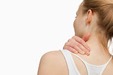 Woman massaging her painful neck