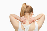 Woman massaging her nape with her hands