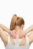 Blonde woman massaging her painful neck