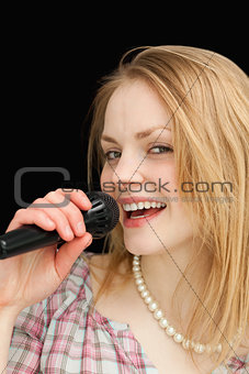 Fair-haired woman singing
