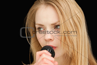 blond-haired woman singing