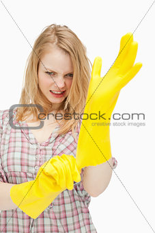 furious woman wearing cleaning gloves