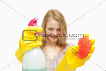 Woman presenting cleaning products
