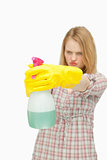 Young woman holding a spray bottle