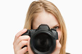 Young woman holding a camera