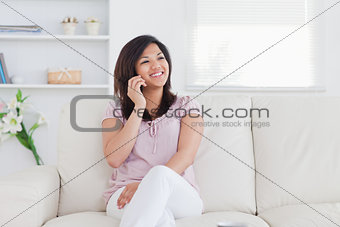 Woman smiling and ohoning