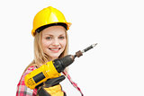 Woman holding an electric screwdriver while smiling