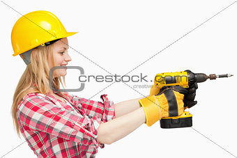 Woman using an electric screwdriver