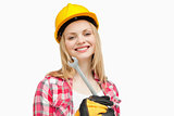 Woman holding a wrench while smiling