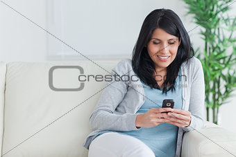 Woman writing on a phone