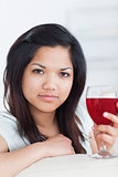 Close-up of a woman holding a glass of wine