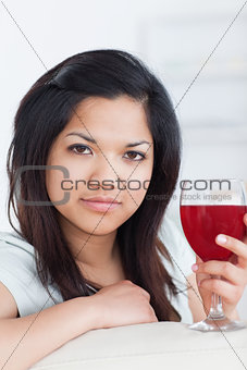 Close-up of a woman holding a glass of wine