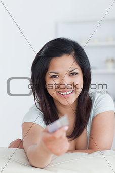 Smiling woman holding a card